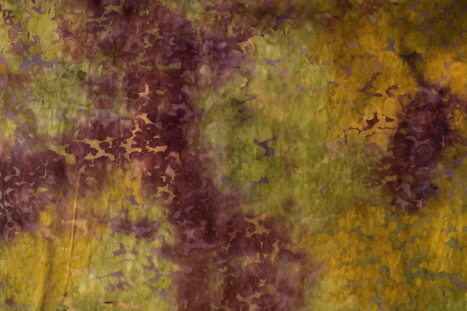 Abstract pattern with brown and green colors on a textured background