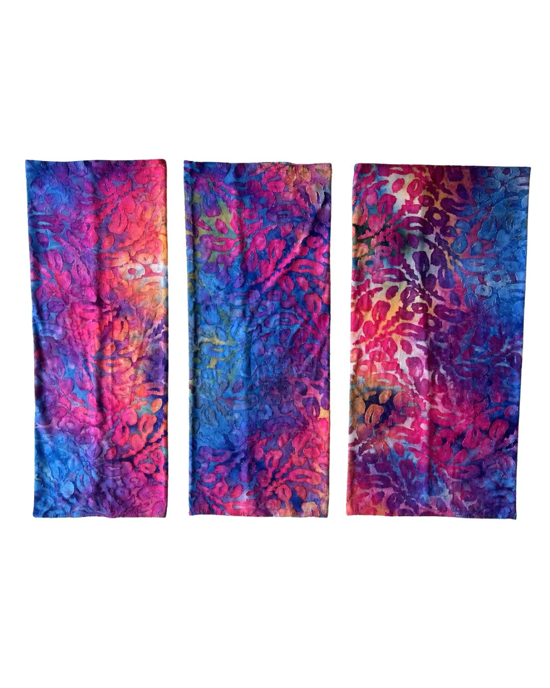 Three colorful tie-dye scarves on a white background